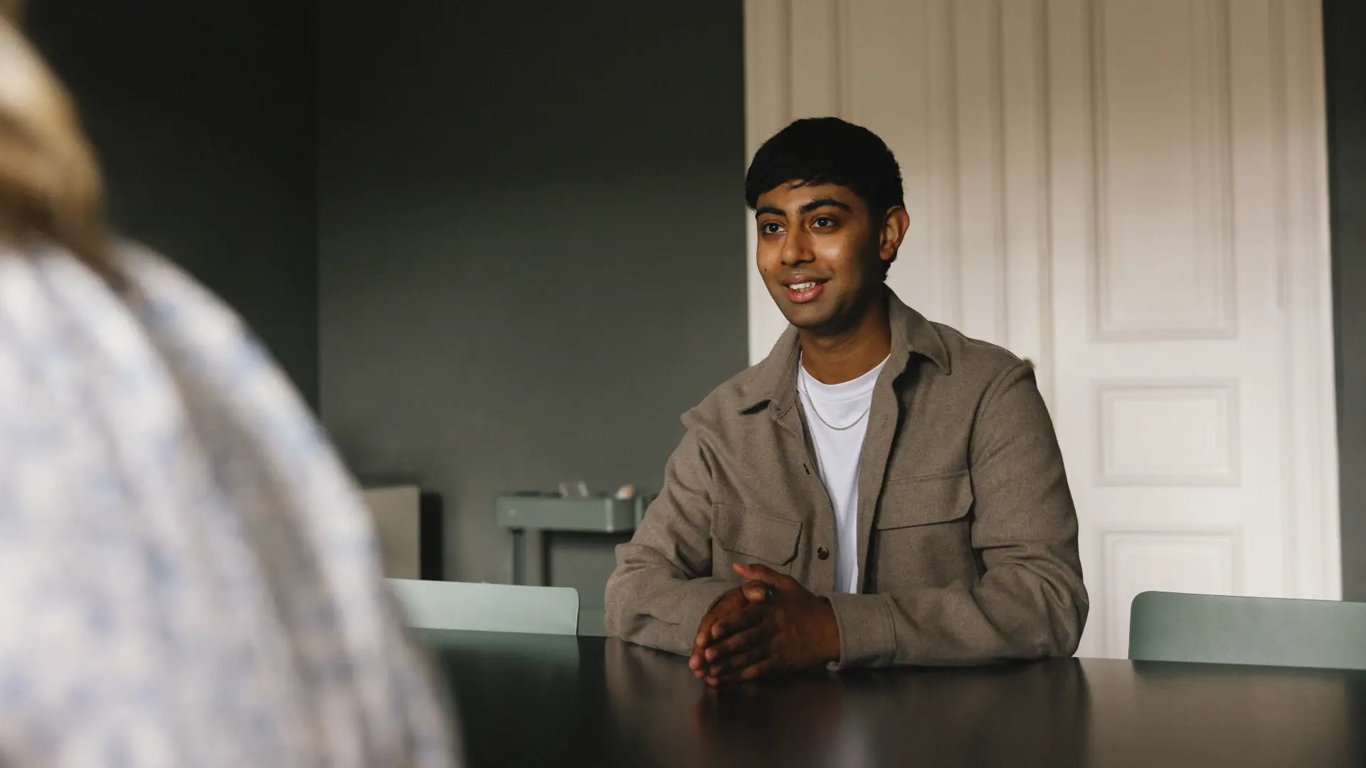 Himal Sapkota at a conference table
